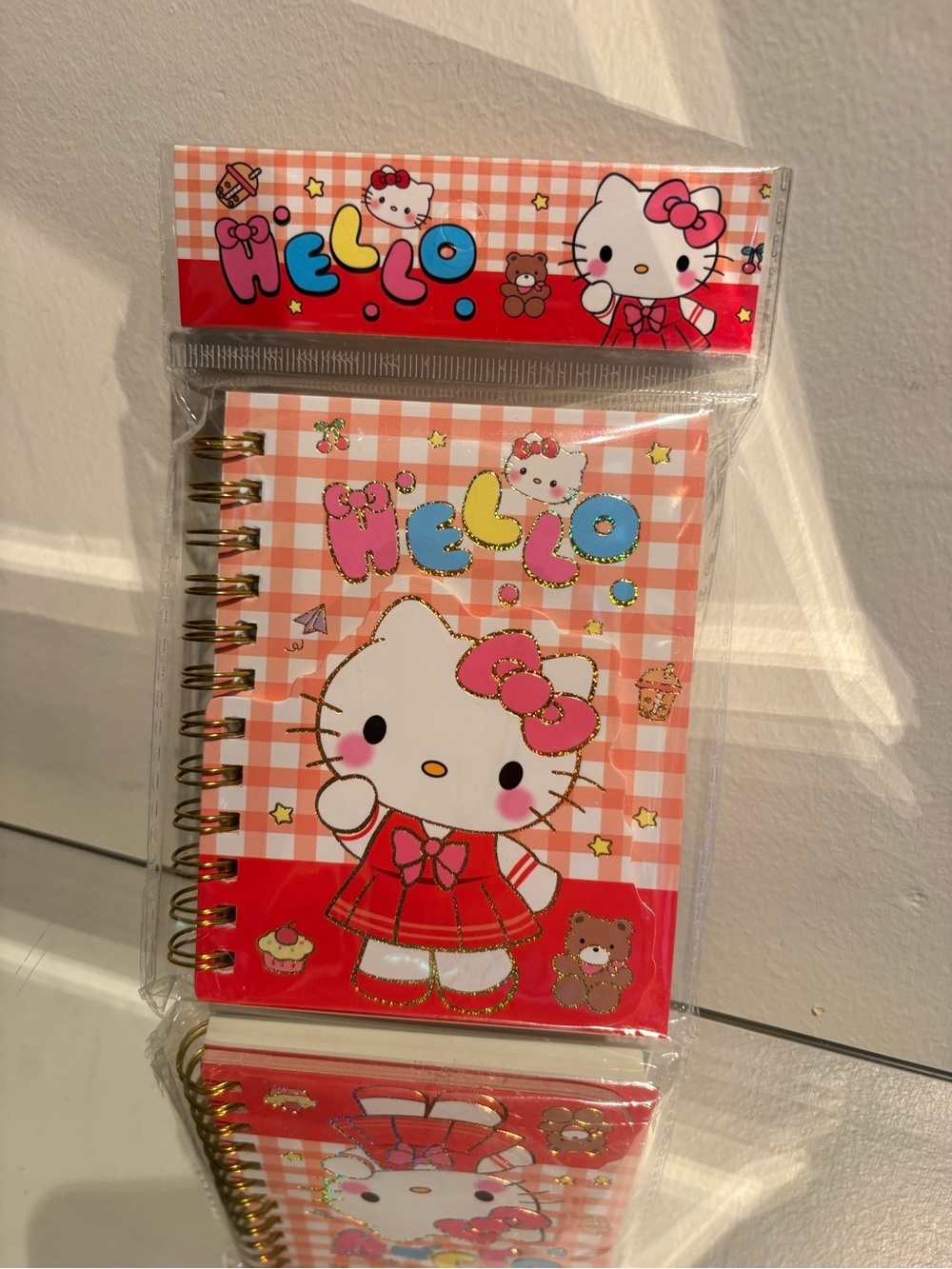 Hello kitty small spiral notebook in red.